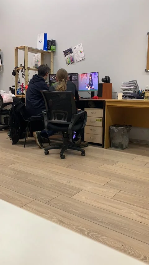 Timelapse. Two 3D model designer programmers in the office discussing a project  Stock-Footage 231611725