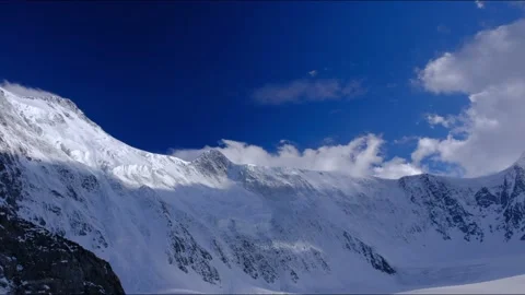 Timelapse of the two peaks of the Russian mountain Belukha in the clouds Stock-Footage 170071189
