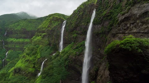 Timelapse - Two waterfalls in one frame in a mountain range 4K60 Stock Footage 268972121