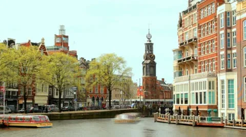 Timelapse, Typical house Fronts, Canal and old clock and bell tower of Amsterdam Stock Footage 10896191