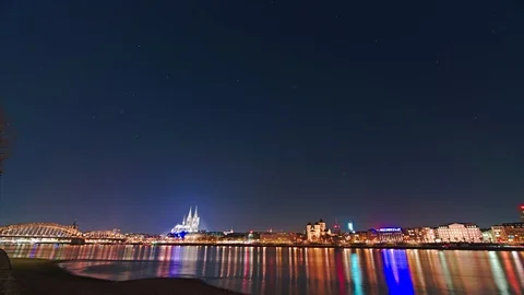 Timelapse of urban star trailing over urban skyline Cologne Cathedral 8k Stock Footage 104260623