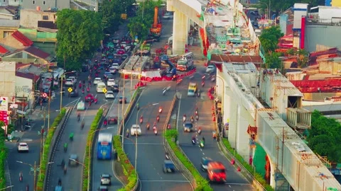 Timelapse of urban streets rush beneath lrt Jakarta Construction Stock Footage 333121058