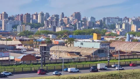 Timelapse of urban traffic moving along a highway with residential building Stock Footage 346330328