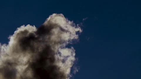 Timelapse of a Vanishing Storm Cloud in Blue Sky Stock Footage 317820045