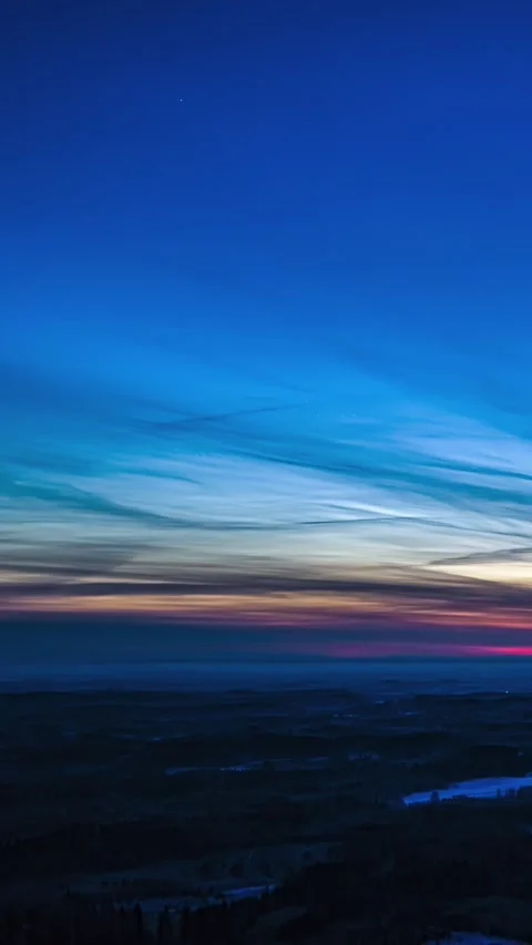 Timelapse of Vibrant Twilight Sky and Clouds Over Expansive Landscape at Dusk Stock Footage 341839041