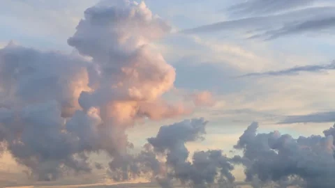 Timelapse video of beautiful clouds in the rays of setting sun after the rain Stock Footage 281649178