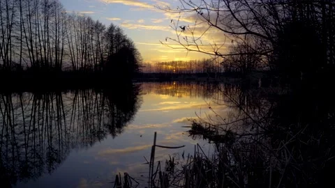Timelapse video of a beautiful, orange sunset on a spring river Stock Footage 131003040