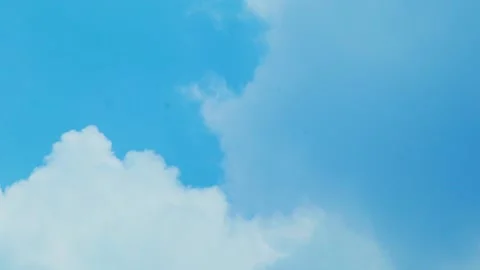 Timelapse video of blue sky with moving white clouds Stock Footage 330566462