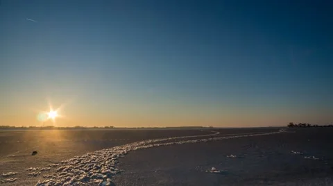Timelapse video of clear sunset ofer a frozen lake in the suburbs of Bucharest Stock Footage 45986833