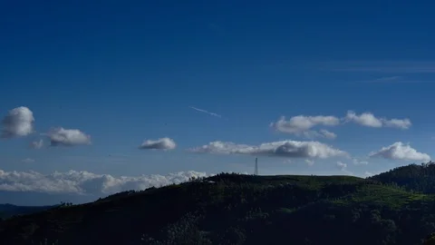 Timelapse video of clouds moving behind mountains in Ooty 스톡 동영상 88252361