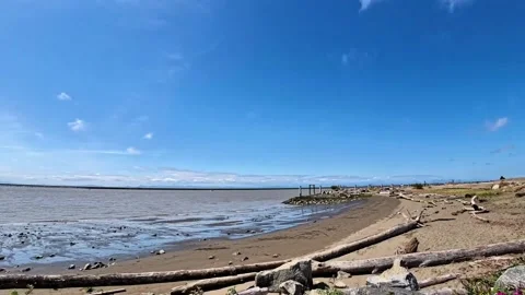 A timelapse video of clouds moving over Gary Point Park beach.  Richmond, Canada Stock Footage 338169832