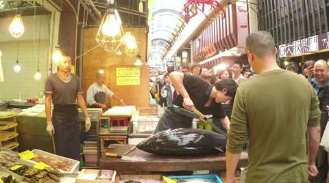 Timelapse video of cutting a giant tuna in a seafood store in a market in Japan Stock Footage 44146151