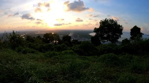 Timelapse video of dramatic clouds moving over green mountain forest. Video stock 328818862