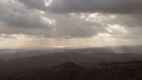 Timelapse video of dramatic sky with sunrays beaming through clouds Stock Footage 93153260