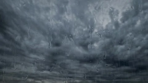 Timelapse video of heavy rain dark storm clouds and water drops - loop video Stock Footage 290062442
