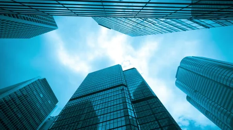 Timelapse video of office buildings with clouds drifting by, blue monotone Stock Footage 42077524