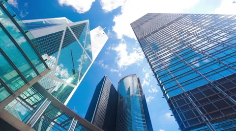 Timelapse video of office buildings with reflection of clouds, zooming in Stock Footage 42795182