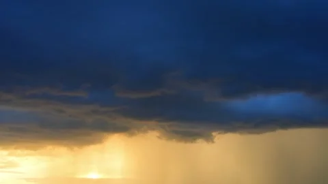 Timelapse video of a rain cloud at sunset. 스톡 동영상 337158101