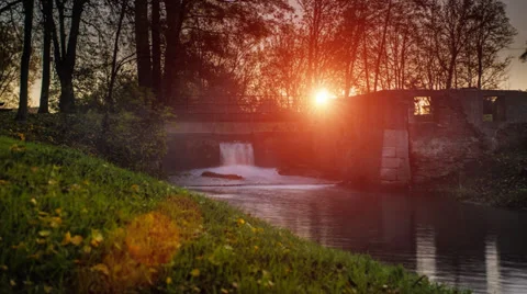 Timelapse video of sunrise over a small river in a park Stock Footage 35879367