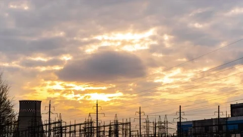 Timelapse video of sunset clouds over power plant Stock Footage 153310632
