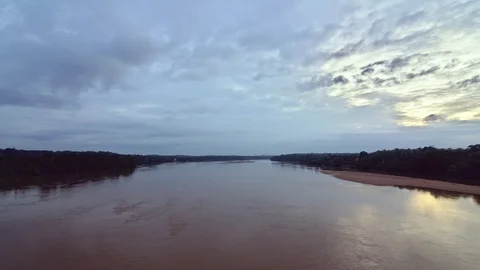 Timelapse video of sunset over an overflowing river during monsoon 스톡 동영상 87367590