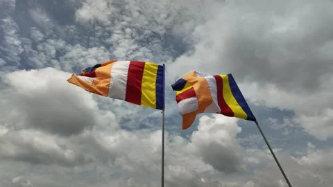 Timelapse Video of Two Colourful Buddhist Flags Waving in the Wind Against Stock Footage 313529814