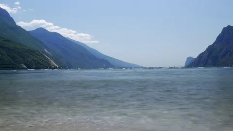 Timelapse video with windsurfers sailing on strong wind and waves at Lake Garda Stock Footage 80561830