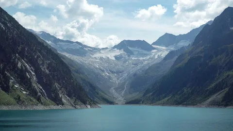 Timelapse with view on beautiful alpine lake surrounded by alps mountains Stock Footage 121343398
