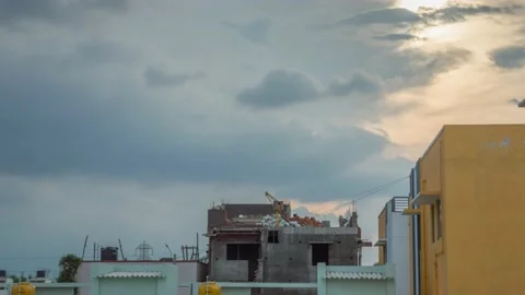 Timelapse view from below of two builders working on the new frame house roof. Stock Footage 171257185