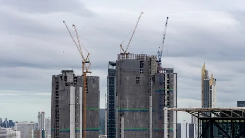 Timelapse view of big construction cranes working on top of high-rise buildings Stock Footage 278055934