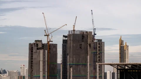 Timelapse view of big construction cranes working on top of high-rise buildings Stock Footage 278056978