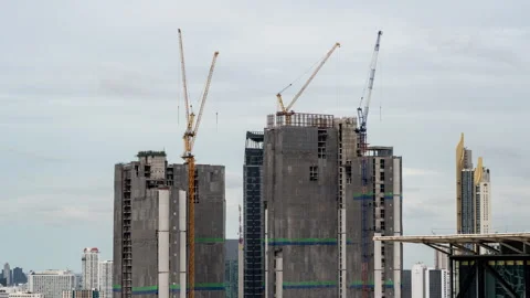 Timelapse view of big construction cranes working on top of high-rise buildings Stock Footage 278057811