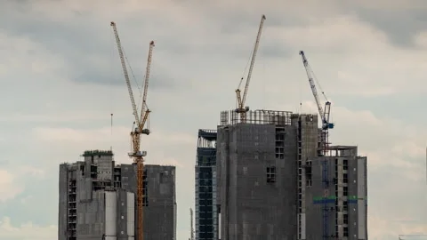 Timelapse view of big construction cranes working on top of high-rise buildings Stock Footage 278058394