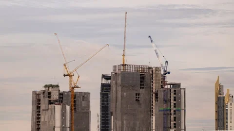 Timelapse view of big construction cranes working on top of high-rise buildings Stock Footage 278069789