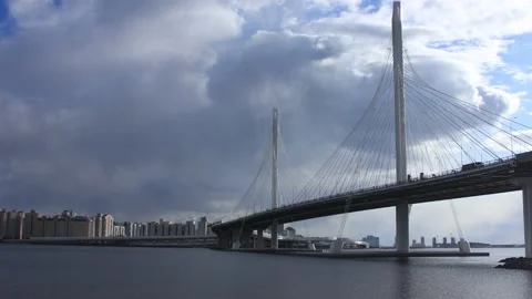 Timelapse view to the bridge in the city on a clear sunny day Stock Footage 130178139