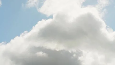 Timelapse view of bright heaven clouds rolling on blue sky, bright sunlight Stock Footage 196968109