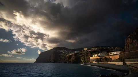 Timelapse view of Câmara de Lobos beach with Cape Girão and clouds Stock Footage 301718591