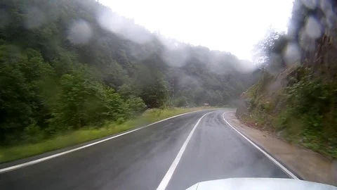 Timelapse of view in car on rainy day roadway Video stock 78729112