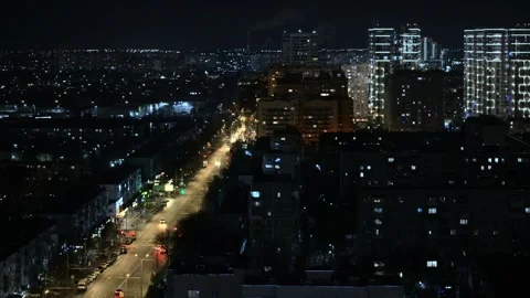 Timelapse with a view of the city lights at night, buildings and active traffic. Stock Footage 312077608