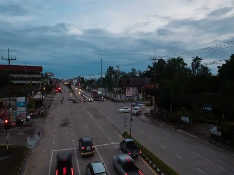 Timelapse view cityscape traffic cars on the road in busy chiang rai city Stock Footage