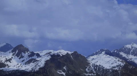 Timelapse view, Clouds and snow-capped mountains in the Swiss Alps Stock Footage 48512687