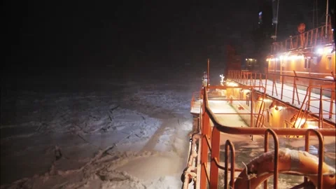 Timelapse of view on deck of Nuclear Icebreaker sail in the night. Snowfall Stock Footage 142419417