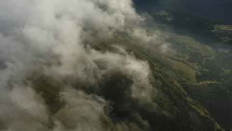 Timelapse view of dense clouds over a mountains at sunrise timelapse footage Stock Footage 121146419