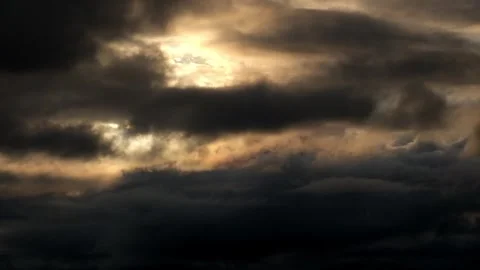 Timelapse view of dramatic black clouds covering the sun Stock Footage 293607143