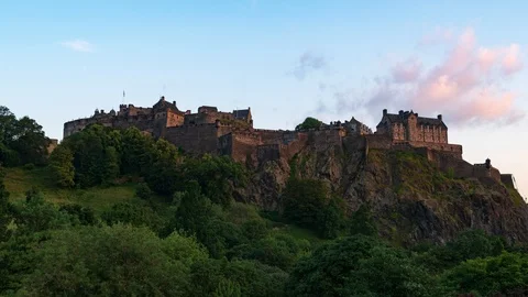 Timelapse view of Edinburgh castle from Princes street gardens at sunset Stock Footage 114214771