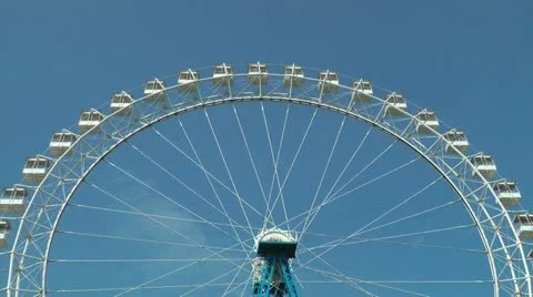Timelapse view of the ferris wheel on blue sky background, HD Stock Footage 10904533