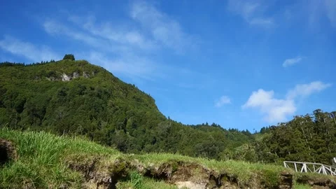 Timelapse. View of the hill from below. Blue sky with clouds. Video stock 133137266