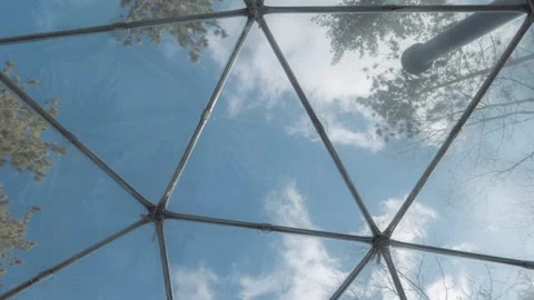 A timelapse of a view from the inside of a geodesic dome accommodation Stock Footage 256762236