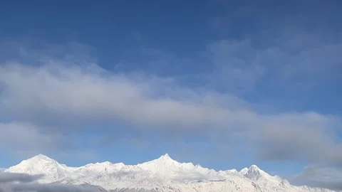 Timelapse View of Majestic Snow Capped Mountains Against Blue Sky China Stock Footage 338311715