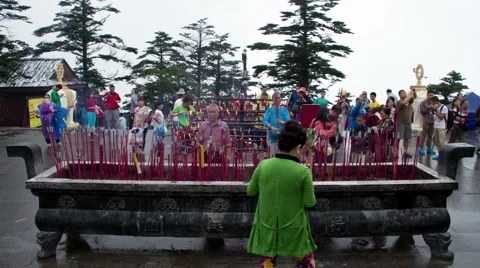 Timelapse view of many pilgrims burning joss sticks  Stock-Footage 40740392
